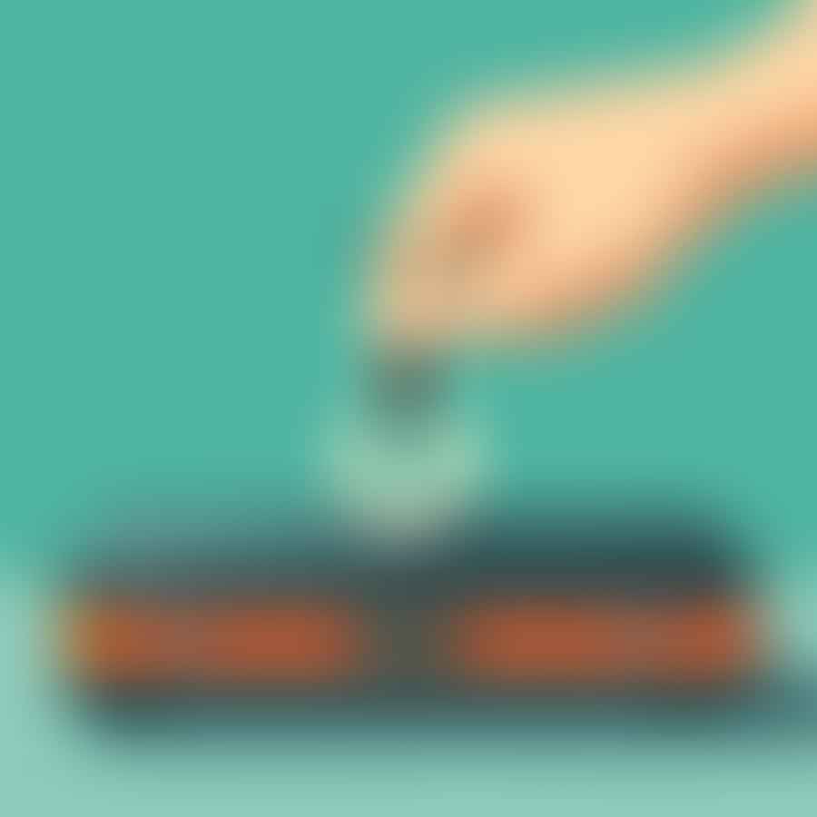 A hand pressing the zero button on a luggage scale